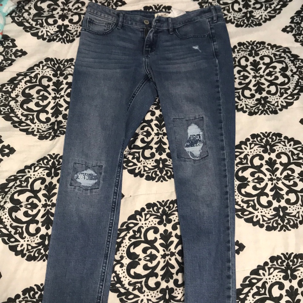 cute pants with rip slits on the knee with design